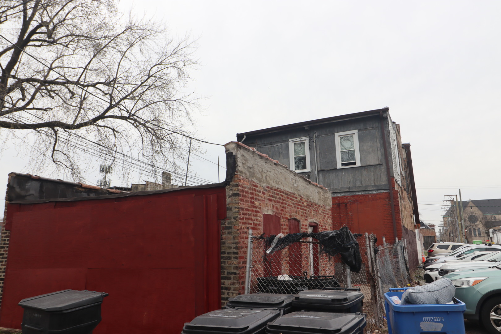 5517 South Halsted Street Chicago, IL 60621 - Photo 5 of 8 a front view of a house with a yard