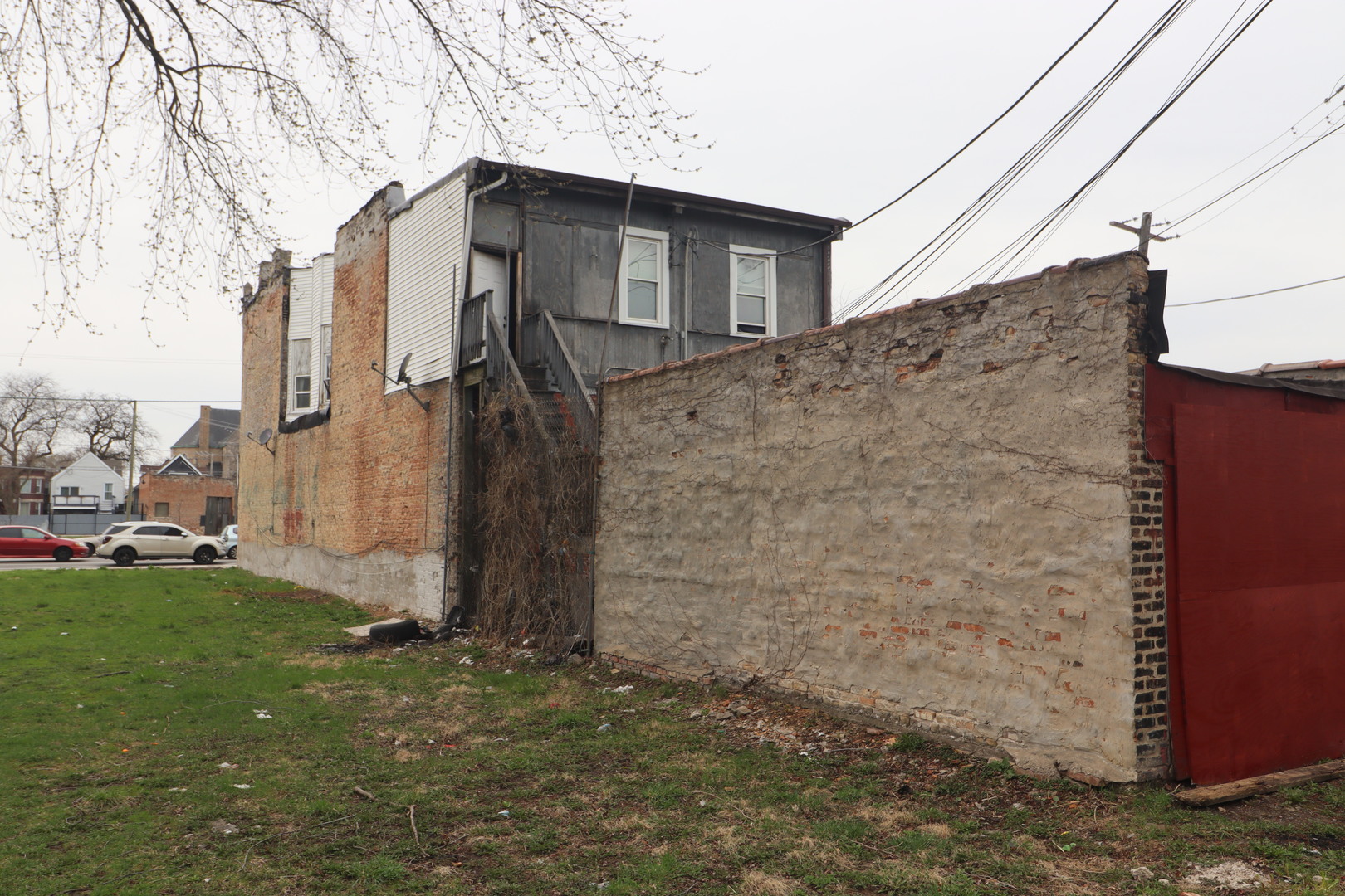5517 South Halsted Street Chicago, IL 60621 - Photo 7 of 8 a brick house with a yard