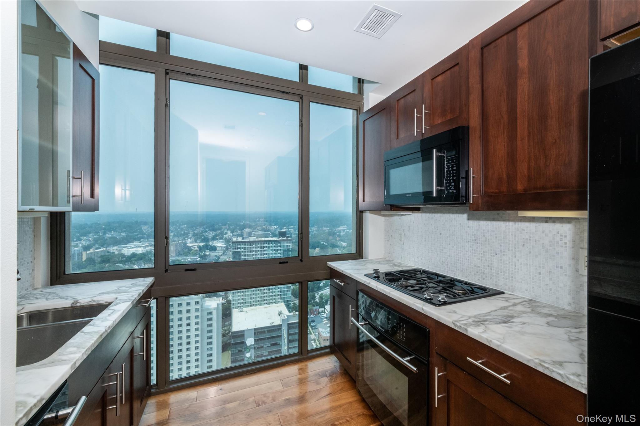 175 Huguenot Street, Unit PH204 New Rochelle, NY 10801 - Photo 3 of 10 With floor to ceiling windows