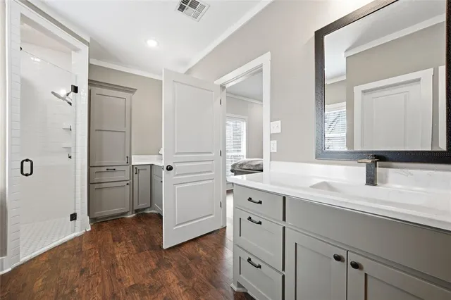 a kitchen with a sink and a refrigerator