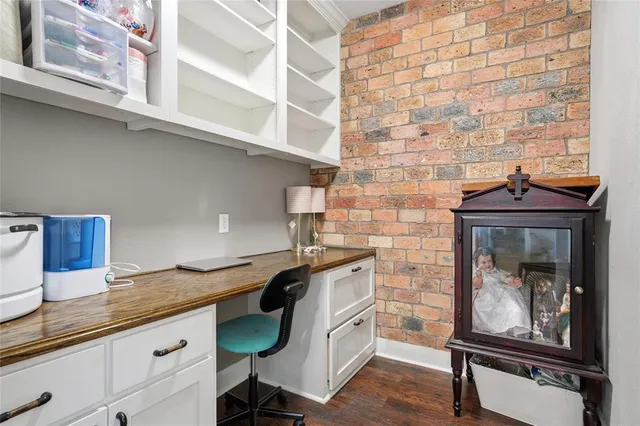 a room with a wooden floor and a sink