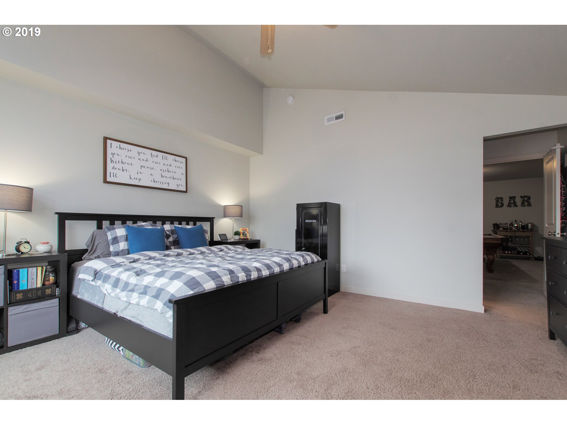 131 North 44th Place Ridgefield, WA 98642 - Photo 12 of 25 a bedroom with a bed and a cabinets