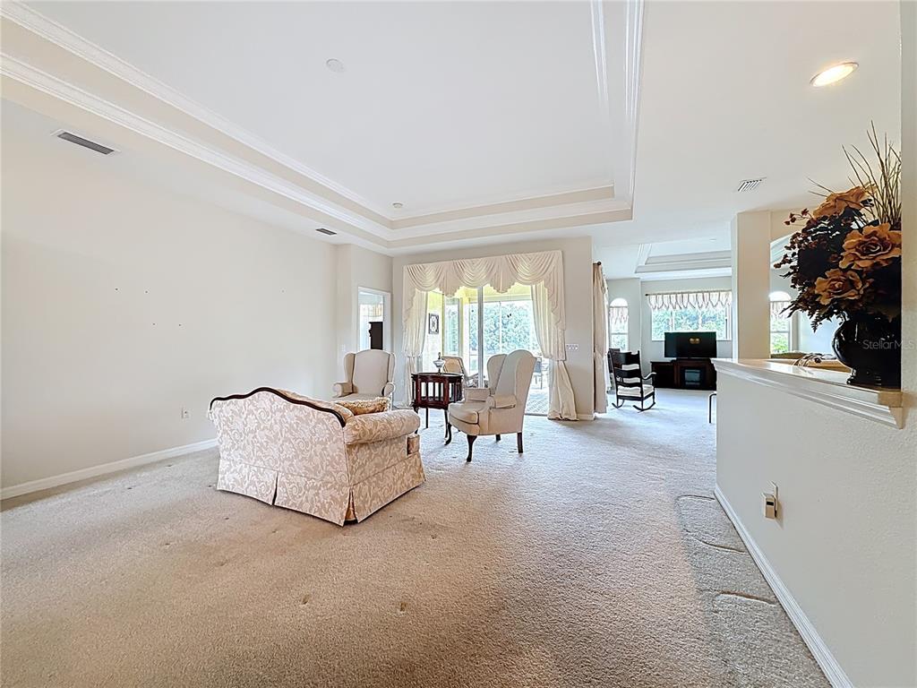 8721 Stone Harbour Loop Bradenton, FL 34212 - Photo 13 of 71 a living room with furniture and a large window