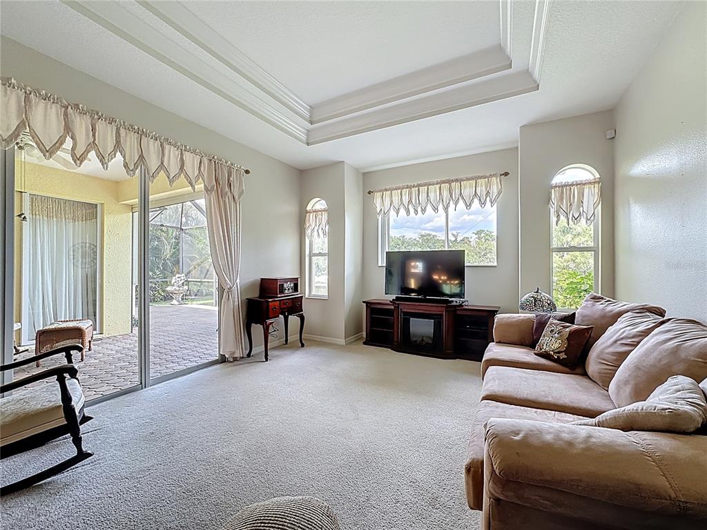 8721 Stone Harbour Loop Bradenton, FL 34212 - Photo 23 of 71 a living room with furniture and a flat screen tv
