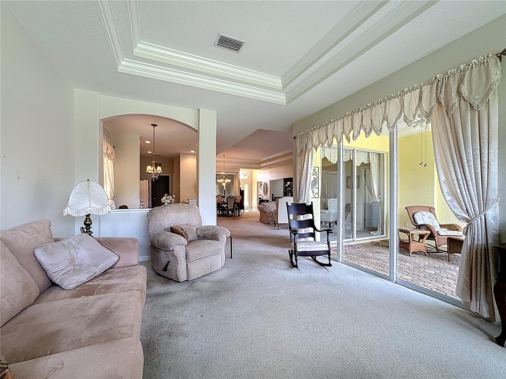 8721 Stone Harbour Loop Bradenton, FL 34212 - Photo 24 of 71 a living room with furniture and a large window