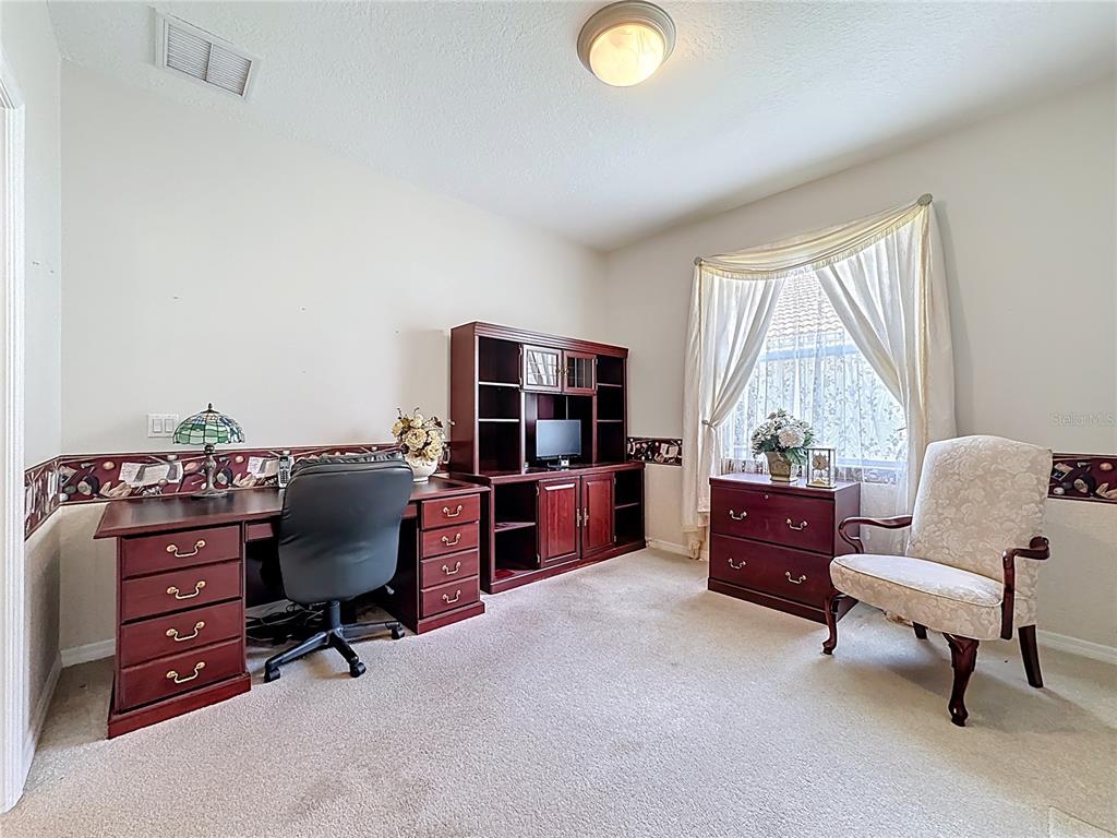 8721 Stone Harbour Loop Bradenton, FL 34212 - Photo 26 of 71 a room with furniture and a window