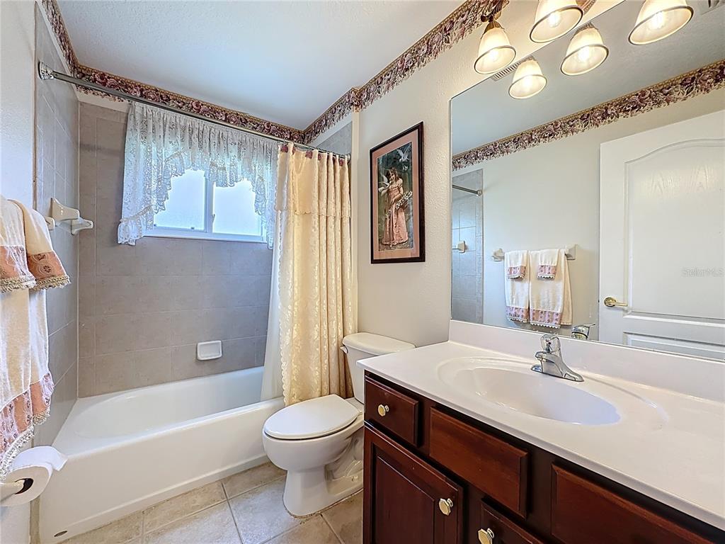8721 Stone Harbour Loop Bradenton, FL 34212 - Photo 30 of 71 a bathroom with a sink a toilet and a bathtub