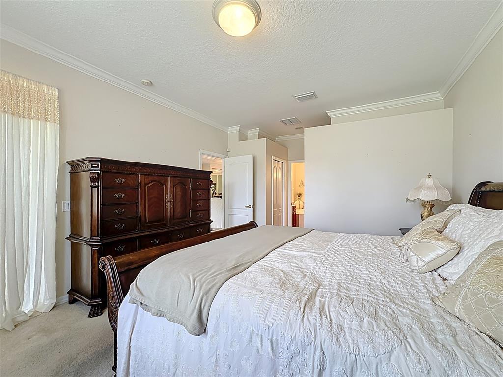 8721 Stone Harbour Loop Bradenton, FL 34212 - Photo 31 of 71 a bedroom with a bed and a television