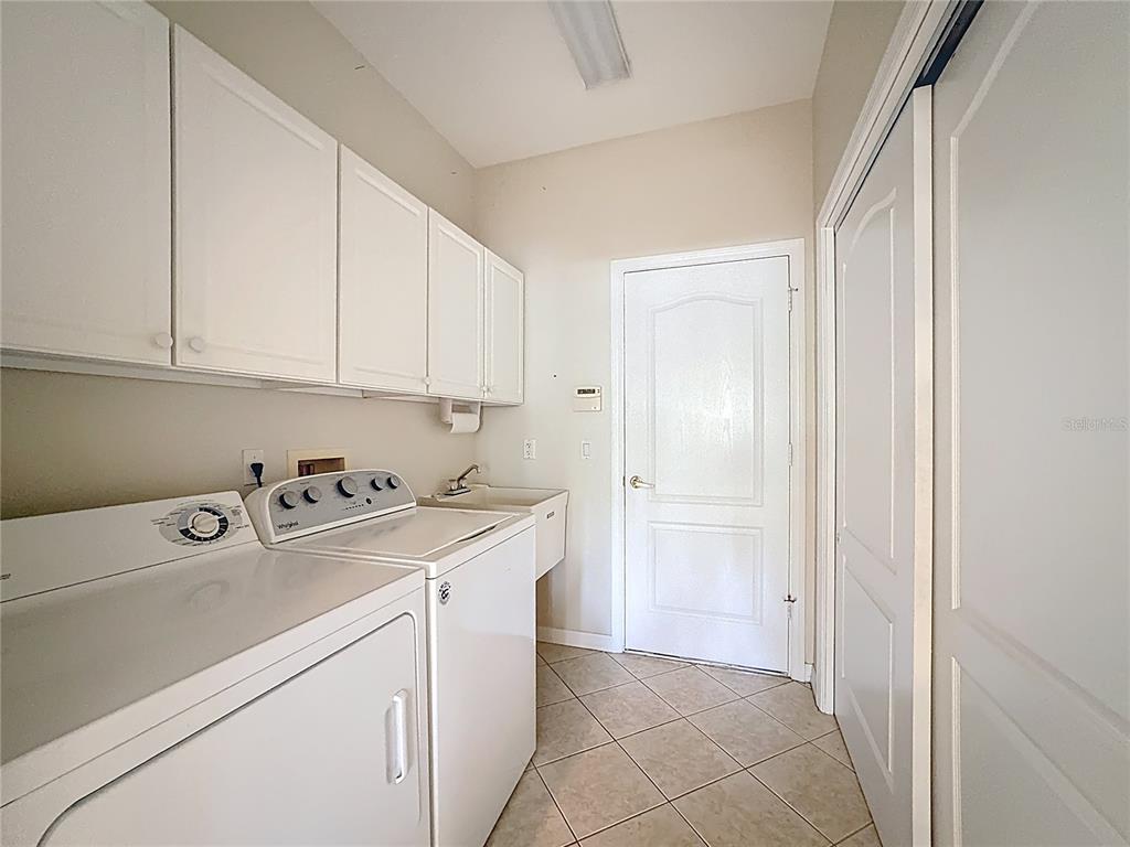 8721 Stone Harbour Loop Bradenton, FL 34212 - Photo 36 of 71 a view of a storage and utility room with washer and dryer