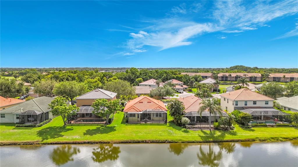 8721 Stone Harbour Loop Bradenton, FL 34212 - Photo 4 of 71 an aerial view of residential houses with outdoor space and river