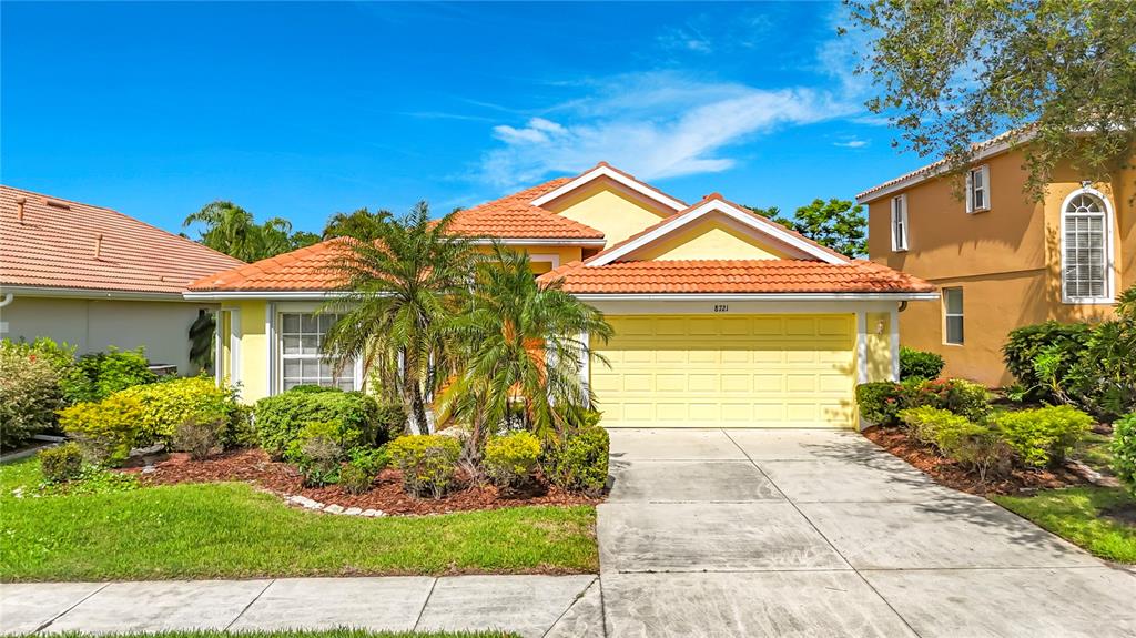 8721 Stone Harbour Loop Bradenton, FL 34212 - Photo 44 of 71 a front view of a house with garden