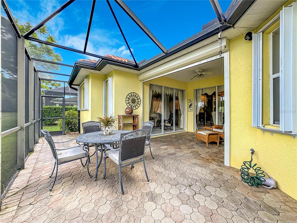 8721 Stone Harbour Loop Bradenton, FL 34212 - Photo 46 of 71 a view of a dinning table and chairs in patio of the house