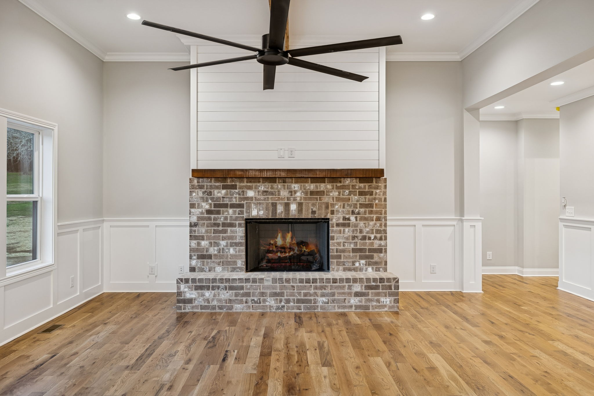 13645 Cainsville Road Lebanon, TN 37090 - Photo 13 of 60 a living room with a fireplace furniture a ceiling fan and wooden floor