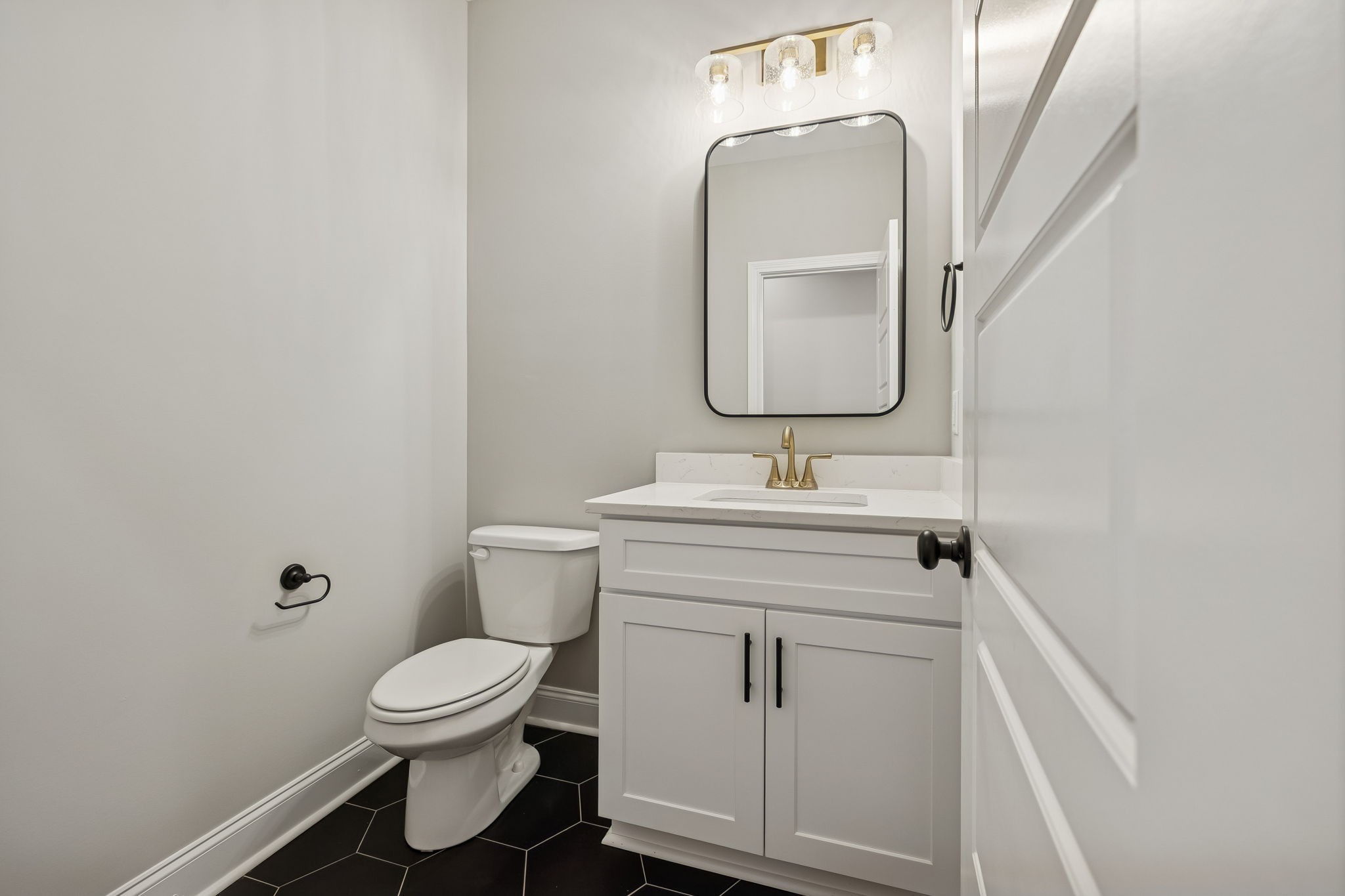 13645 Cainsville Road Lebanon, TN 37090 - Photo 27 of 60 a bathroom with a sink toilet and mirror