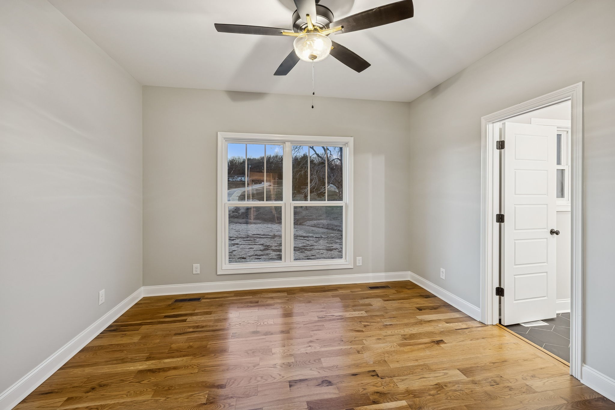 13645 Cainsville Road Lebanon, TN 37090 - Photo 28 of 60 a view of an empty room with window and wooden floor