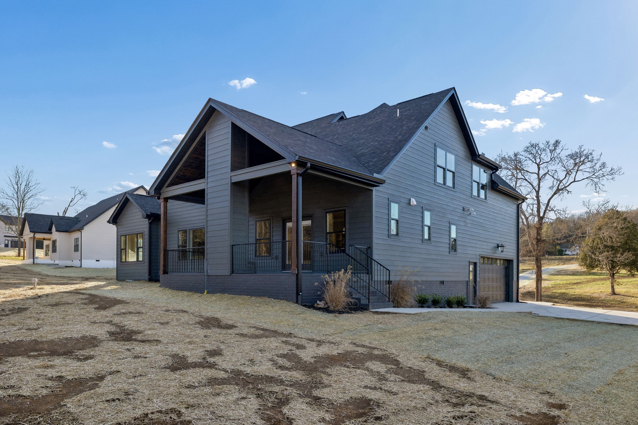 13645 Cainsville Road Lebanon, TN 37090 - Photo 42 of 60 a front view of a house with a yard and garage