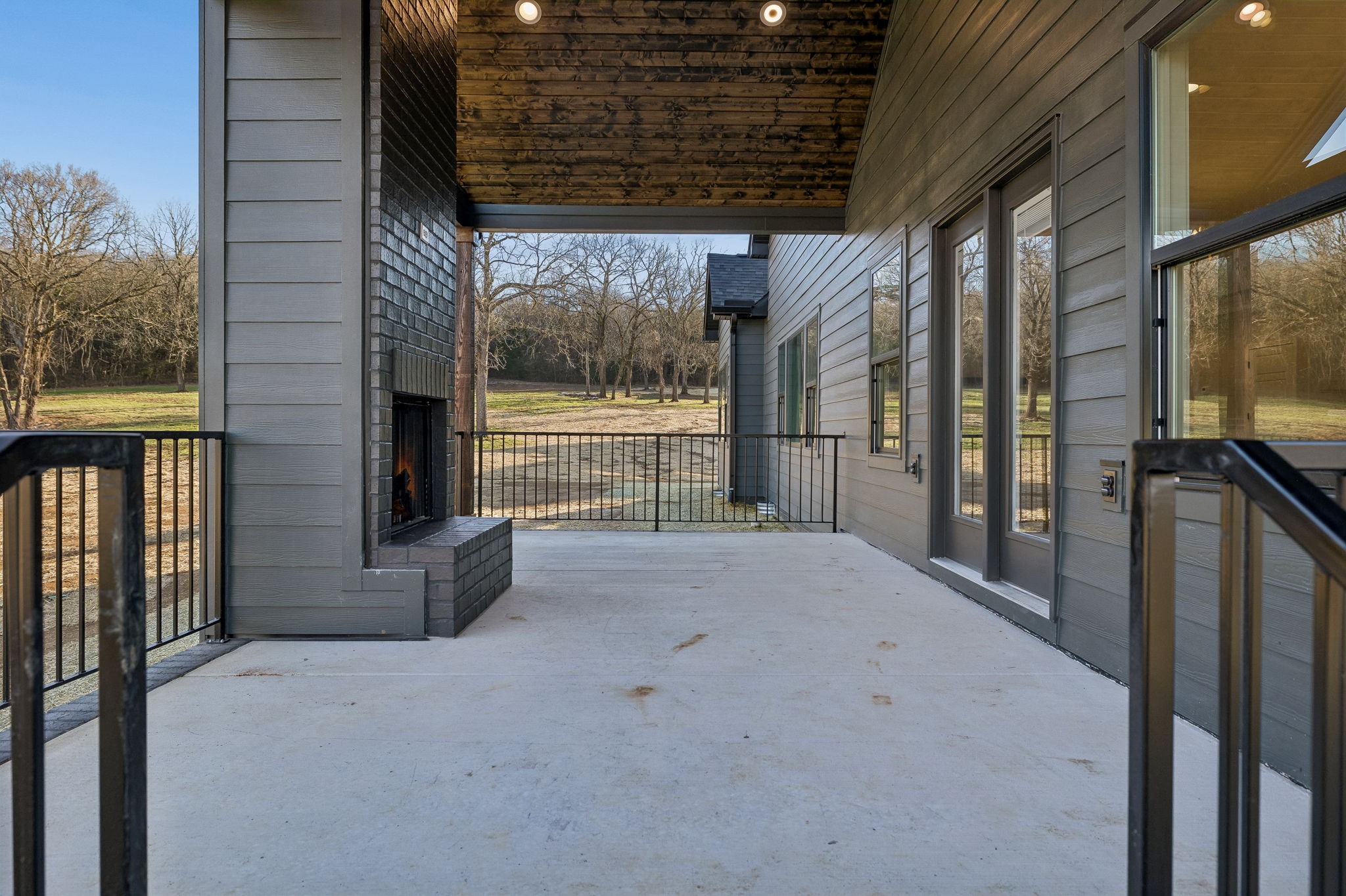 13645 Cainsville Road Lebanon, TN 37090 - Photo 45 of 60 a view of a porch with wooden floor and iron stairs