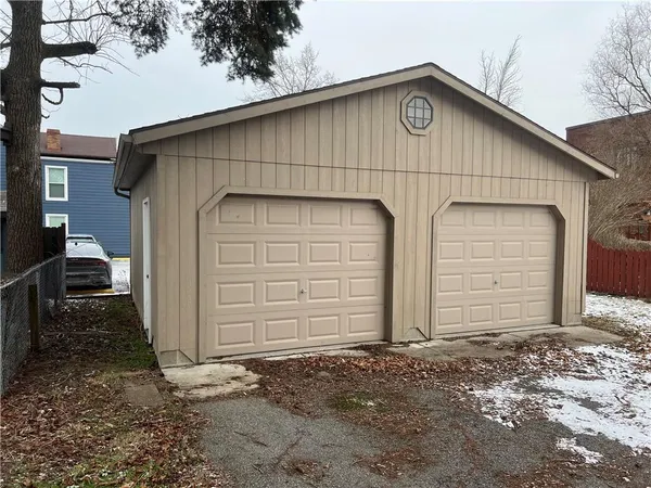a view of house with garage