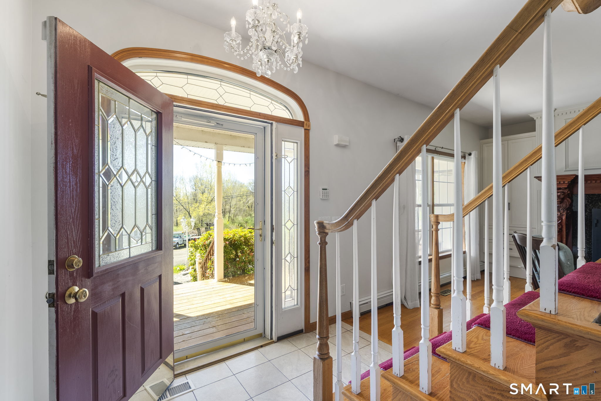 341 High Street Extension Thomaston, CT 06787 - Photo 6 of 39 a view of an entryway with wooden floor and door