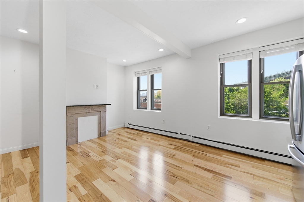54 Beacon Street, Unit 2 Chelsea, MA 02150 - Photo 7 of 26 a view of an empty room with a window