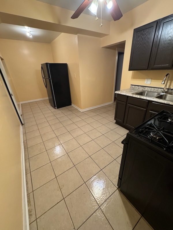 2908 West Fillmore Street, Unit 2 Chicago, IL 60612 - Photo 3 of 7 a kitchen with a refrigerator and a stove