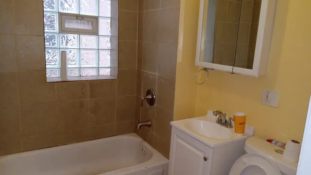 a bathroom with a sink and a bathtub