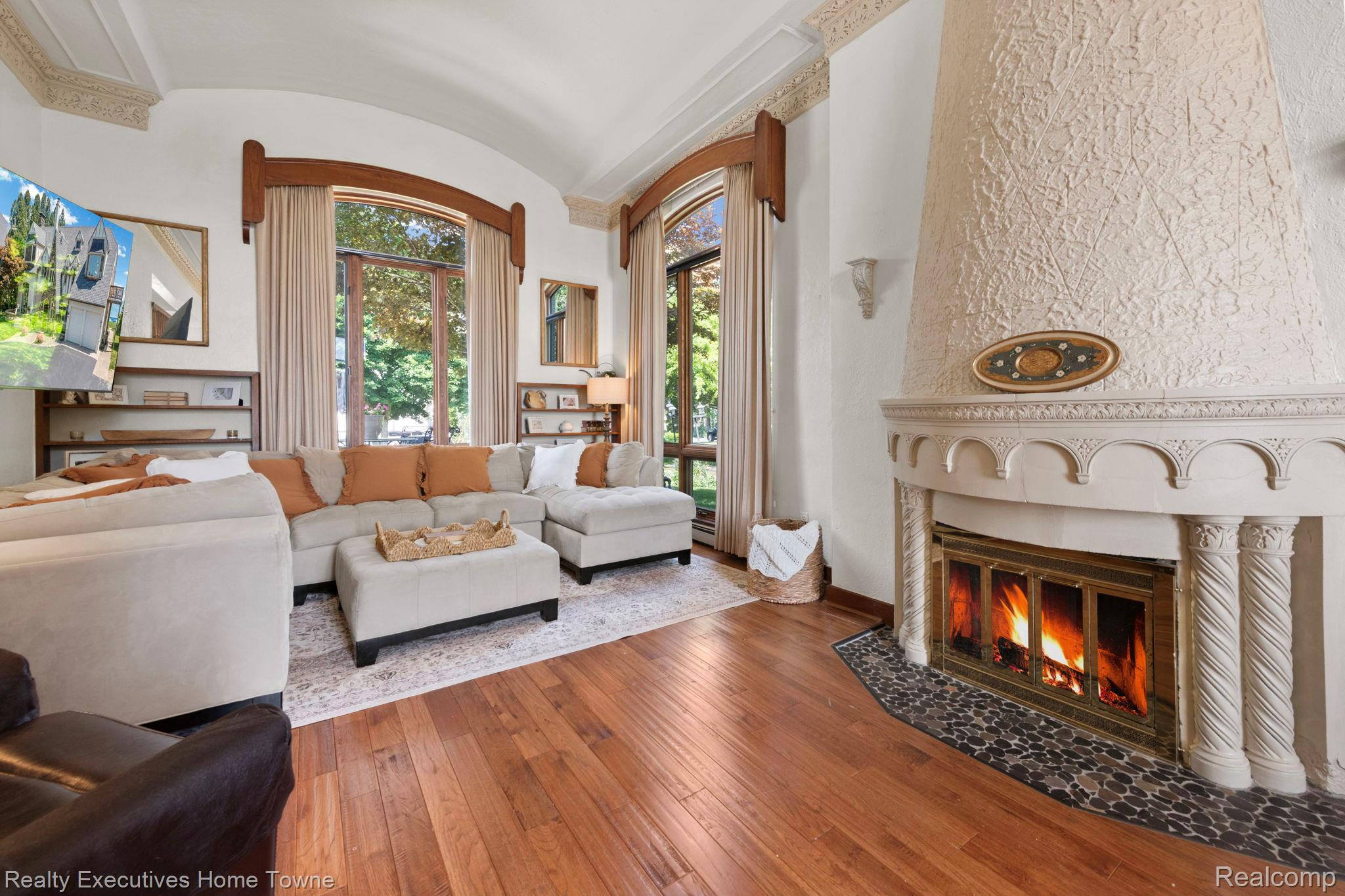8308 Lakeshore Road Fort Gratiot, MI 48059 - Photo 46 of 79 Living area featuring an ornate fireplace with a textured stucco finish and a stone hearth