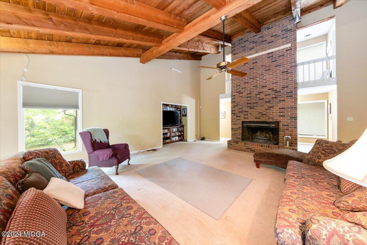 5157 Zebulon Road Macon, GA 31210 - Photo 11 of 34 a bedroom with furniture and a fireplace