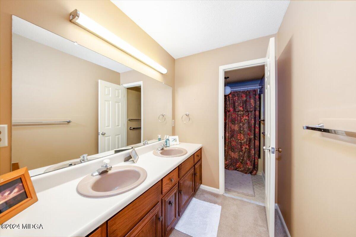 5157 Zebulon Road Macon, GA 31210 - Photo 14 of 34 a spacious bathroom with a double vanity sink and a mirror