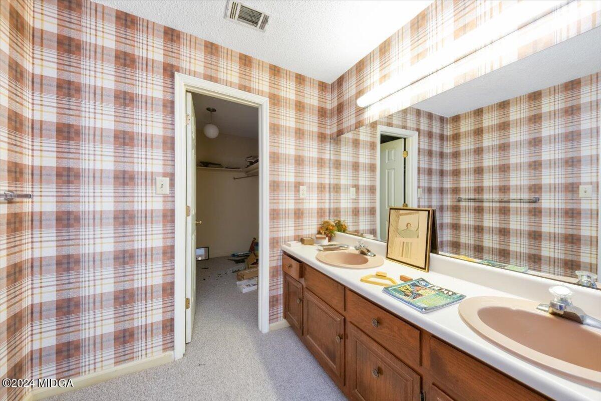 5157 Zebulon Road Macon, GA 31210 - Photo 21 of 34 a bathroom with a double vanity sink mirror and shower