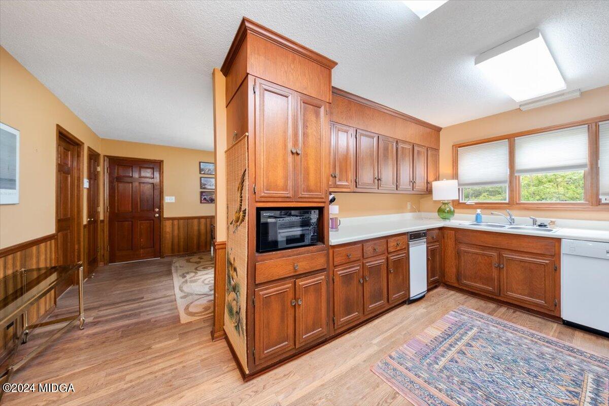 5157 Zebulon Road Macon, GA 31210 - Photo 3 of 34 a large kitchen with stainless steel appliances granite countertop a stove a sink dishwasher and a refrigerator