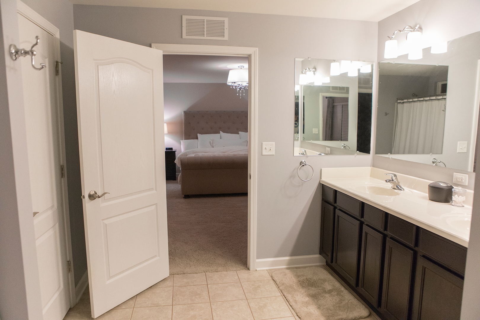5718 Oak Ridge Way Lisle, IL 60532 - Photo 15 of 29 a en suite bathroom with a sink a mirror and a shower