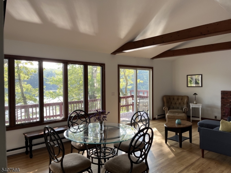 6 Jans Way Andover, NJ 07821 - Photo 8 of 11 a living room with furniture and floor to ceiling windows