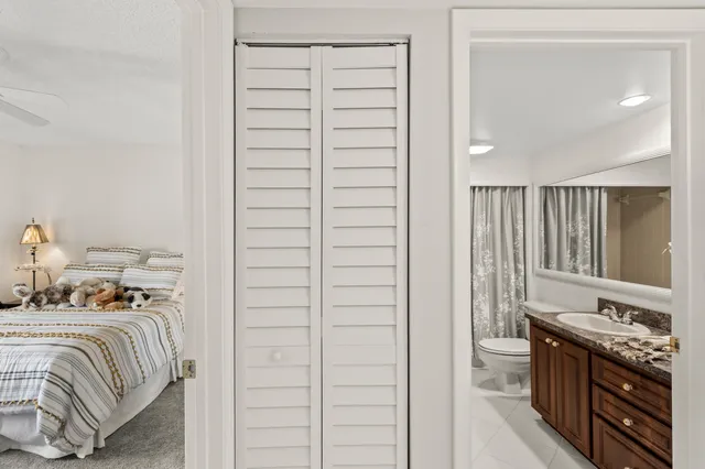 a bedroom with a bed and a dresser