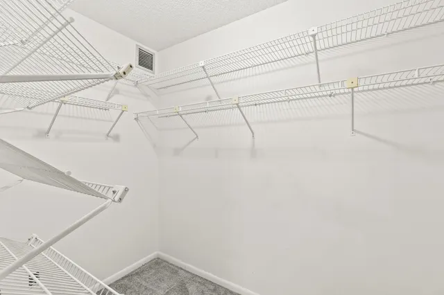 a view of a room with racks on the wall