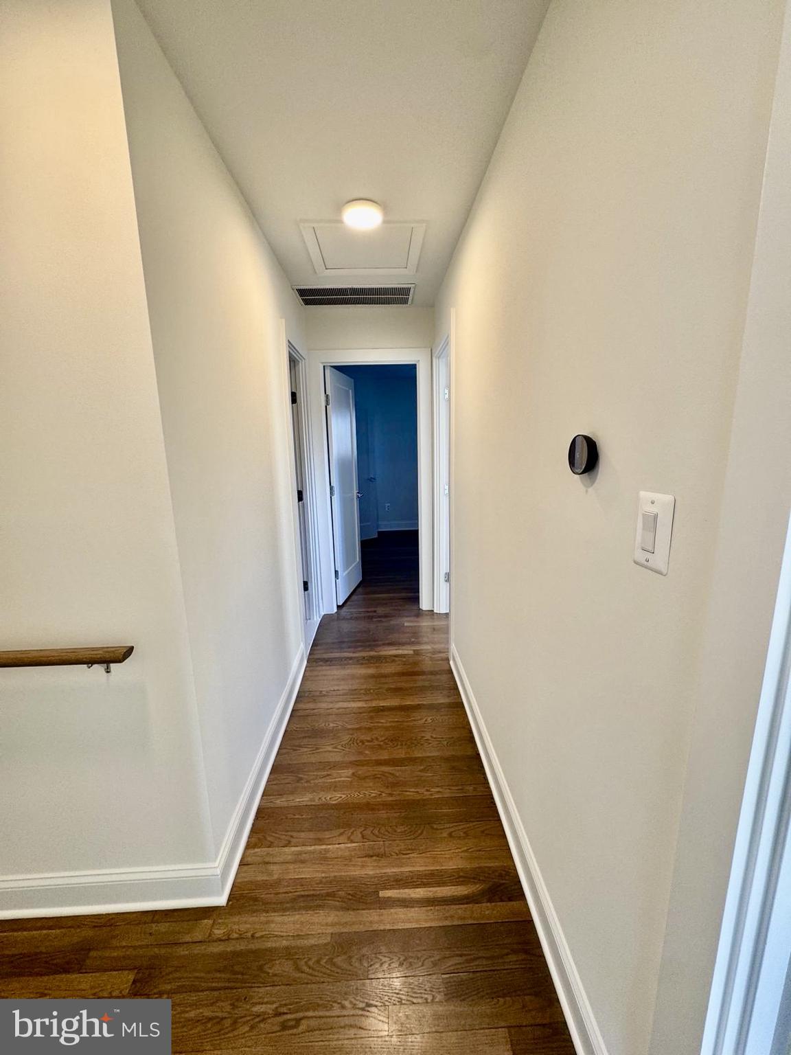 7023 Dolphin Road Lanham, MD 20706 - Photo 16 of 47 a view of a hallway with wooden floor