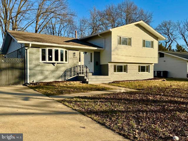 7023 Dolphin Road Lanham, MD 20706 - Photo 2 of 47 a front view of a house with a yard