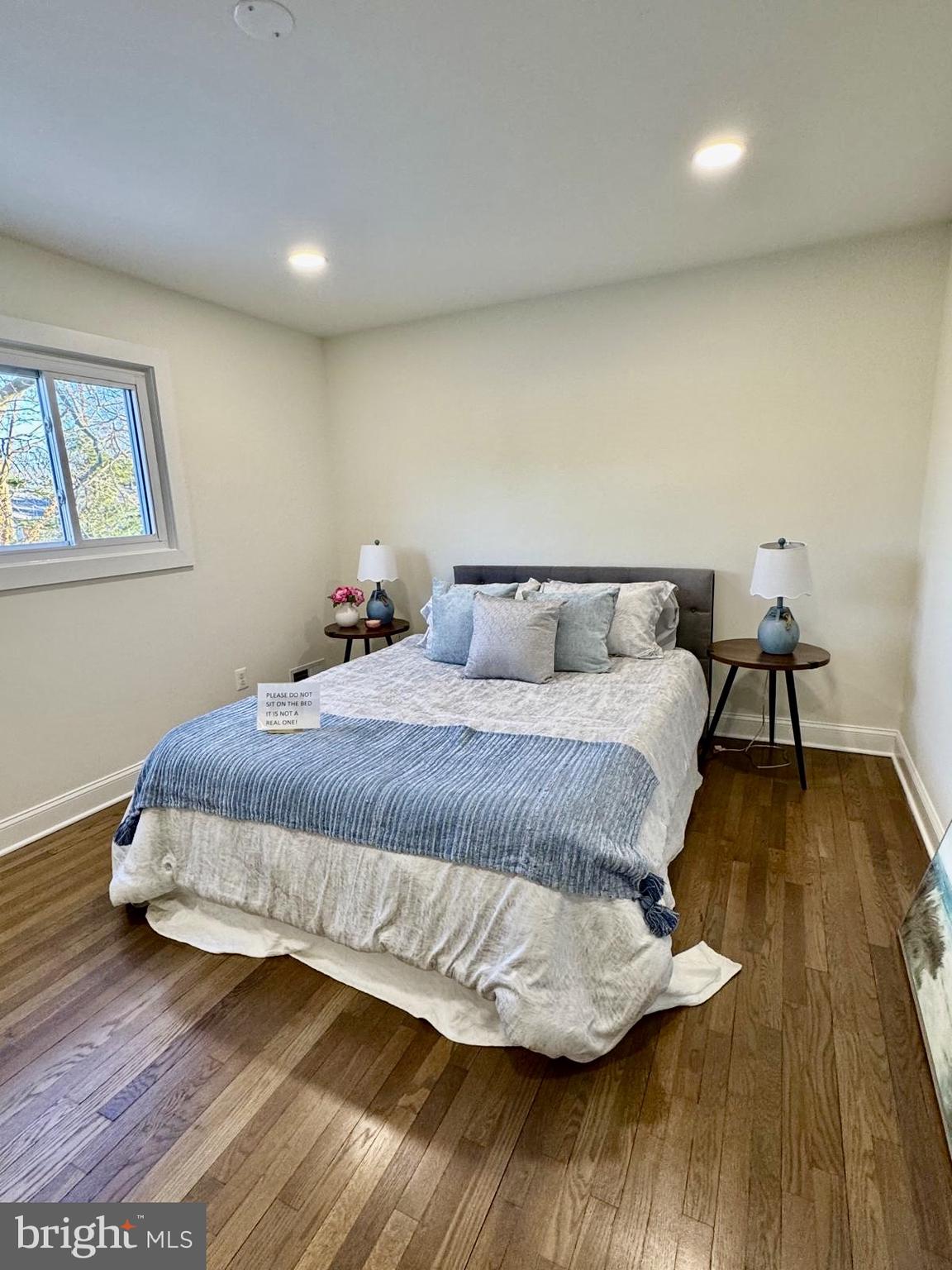 7023 Dolphin Road Lanham, MD 20706 - Photo 21 of 47 a bedroom with a bed and wooden floor