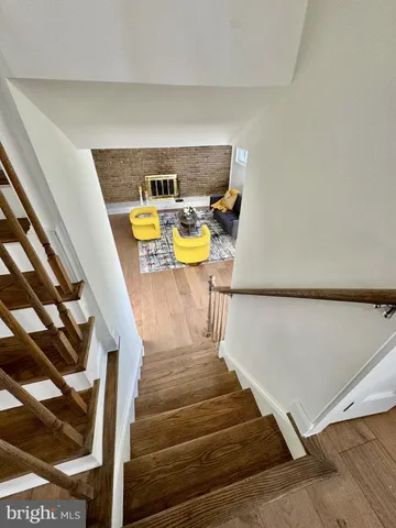 a bedroom with a bed and a chair