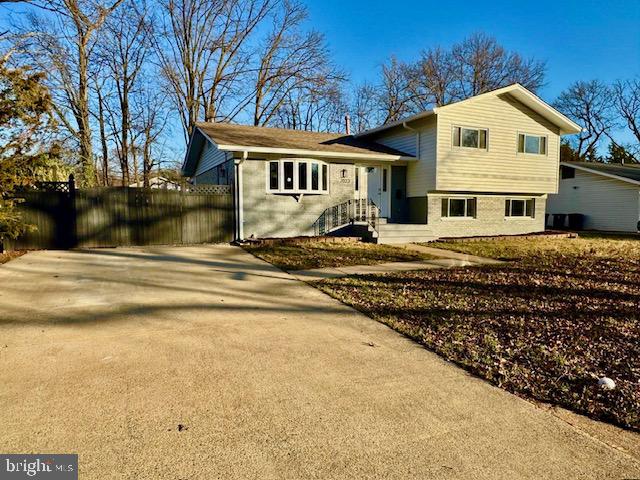 7023 Dolphin Road Lanham, MD 20706 - Photo 3 of 47 a front view of a house with a yard