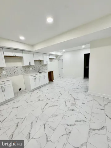 a kitchen with stainless steel appliances cabinets a sink and a counter top space