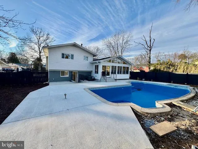 a view of balcony with wooden floor and fence