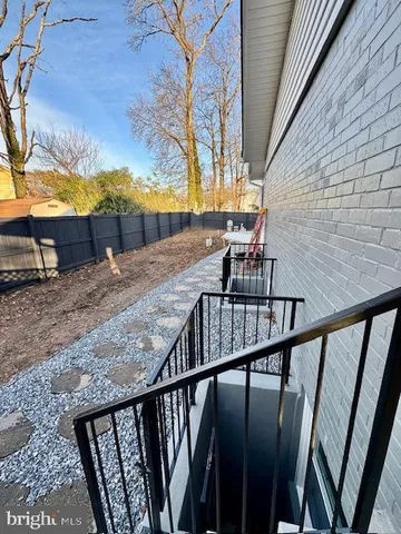 a view of a backyard with a fence