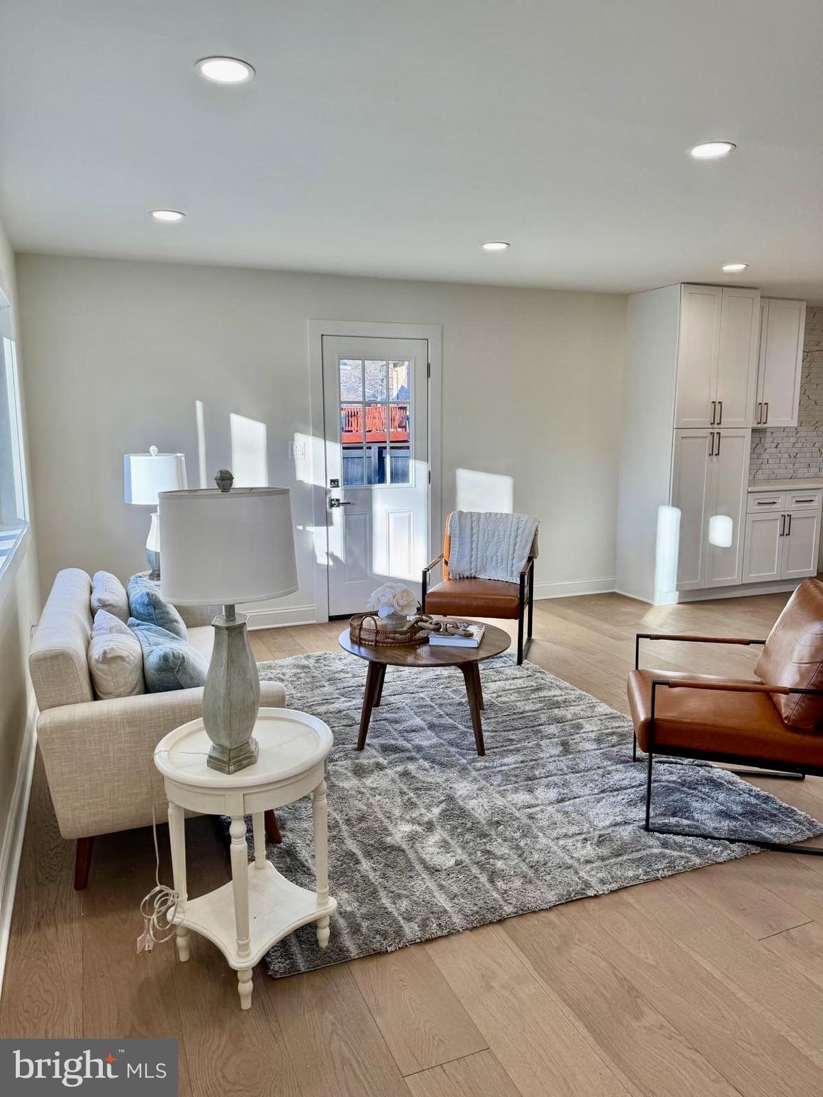 7023 Dolphin Road Lanham, MD 20706 - Photo 7 of 47 a living room with furniture and a table