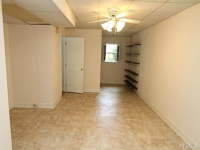 423 Oakridge Road Cary, NC 27511 - Photo 20 of 25 Large Secondary bedroom in the basement can also be used as a library or office! Bedroom