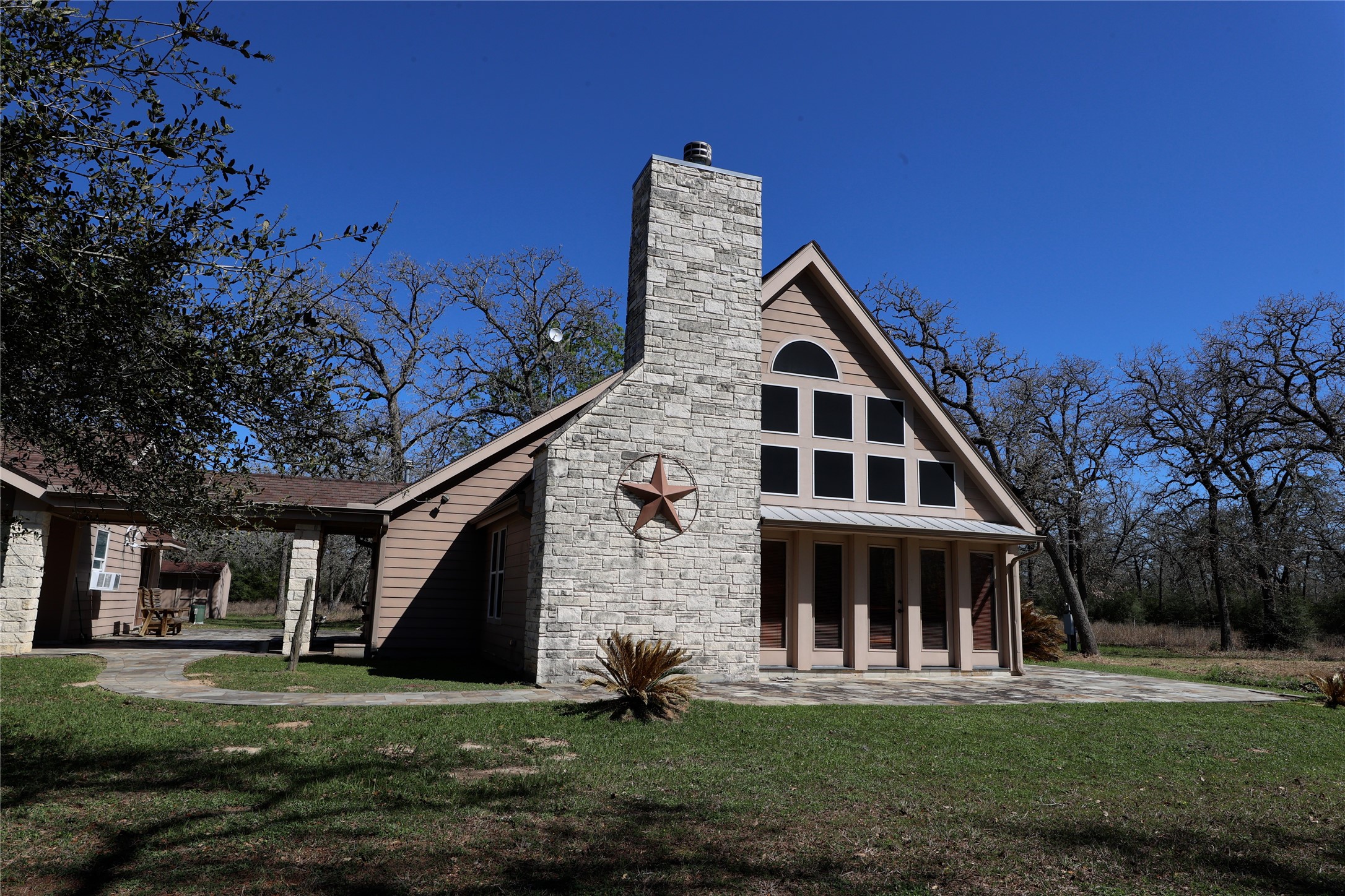3337 Brunes Mill Road Columbus, TX 78934 - Photo 2 of 48 a front view of a house with a yard