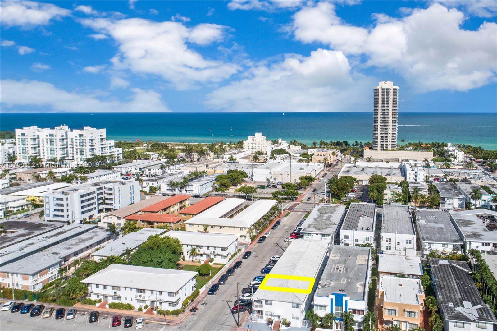 330 74th Street, Unit 7 Miami Beach, FL 33141 - Photo 24 of 27 a view of a city with lawn chairs