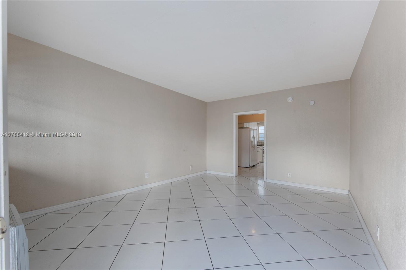 330 74th Street, Unit 7 Miami Beach, FL 33141 - Photo 4 of 27 wooden floor in an empty room