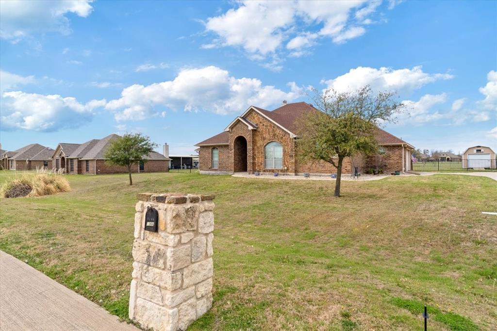 5366 Tree Grace Lane Kaufman, TX 75142 - Photo 1 of 33 a front view of a house with a yard