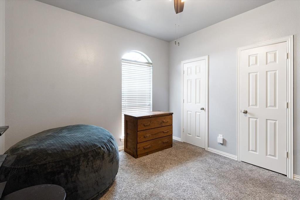 5366 Tree Grace Lane Kaufman, TX 75142 - Photo 23 of 33 a bedroom with a bed and a cabinets